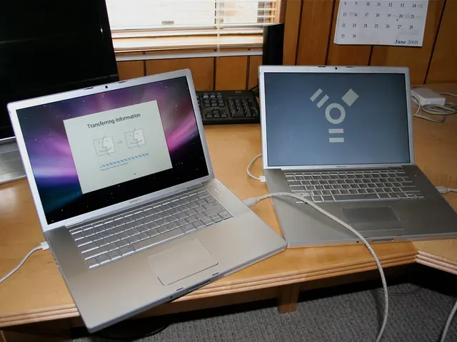 This image consists of two laptops, one computer. There is a calendar on the top. There wires on...