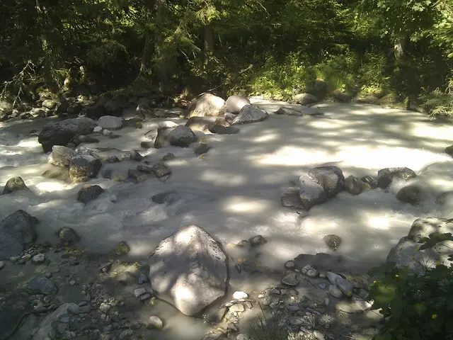 This is the picture of a place where we have water on the rocks and around there are some rocks,...