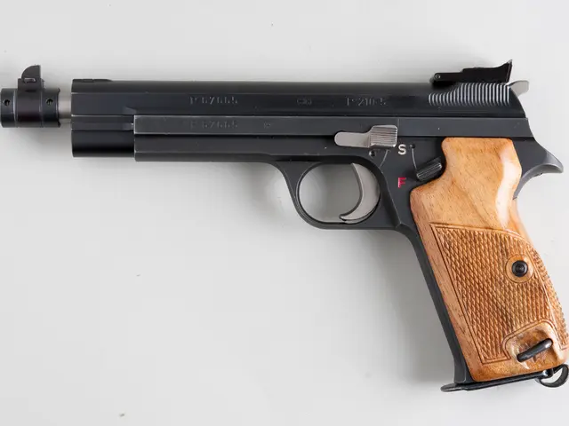 The picture consists of a gun on a white surface.