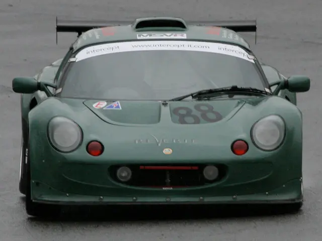 In the foreground of this picture, we see a sports car on which "88" number is written on it. In...