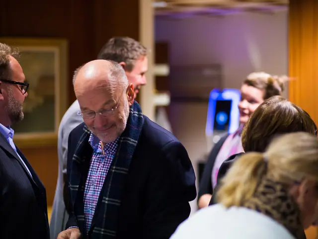 This picture describes about group of people, few people wore spectacles, on the left side of the...