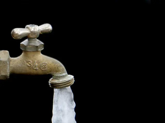 In this image we can see a tap with ice coming from the hole.